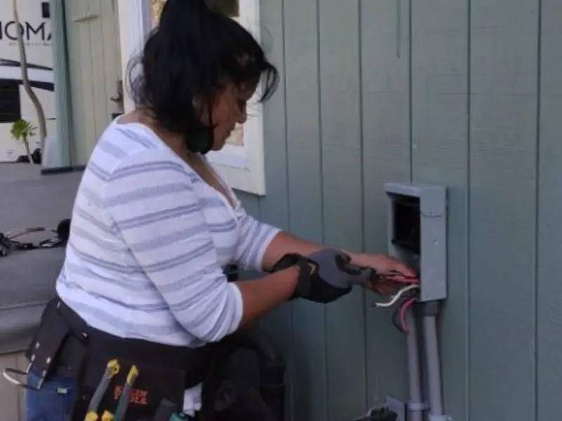 Licensed electrician wiring an exterior subpanel in Rutherfordton