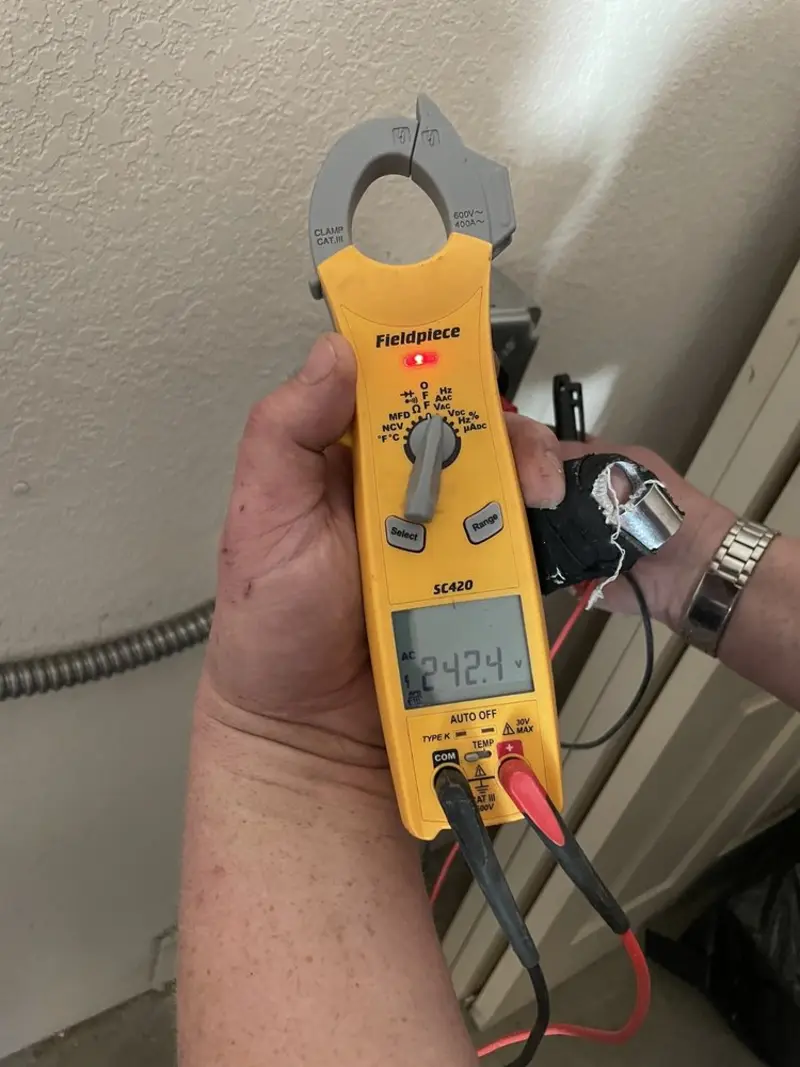 Voltage testing with clamp meter during Recessed Lighting Installation in Rutherfordton